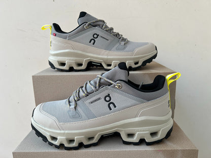 On Cloudrock Low Waterproof Hiking Shoes in Grey / Sand with Yellow Accents